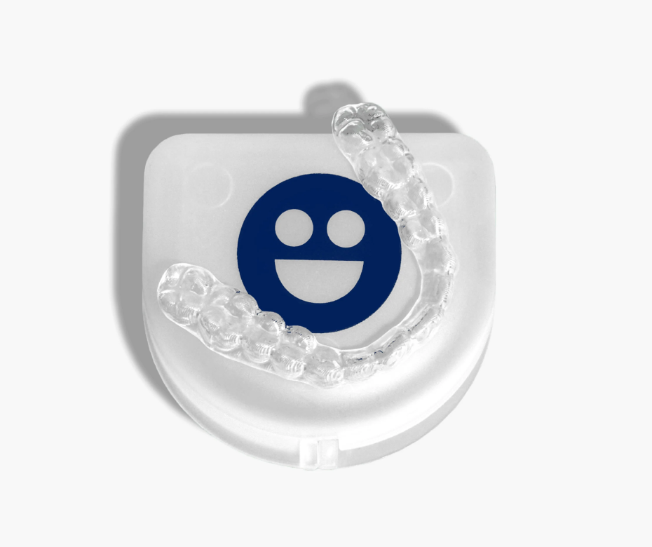 A toothbrush featuring a smiley face design-Cheeky