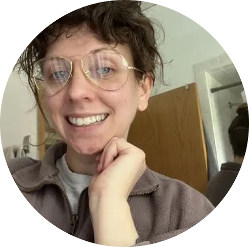 A smiling woman wearing glasses-Cheeky