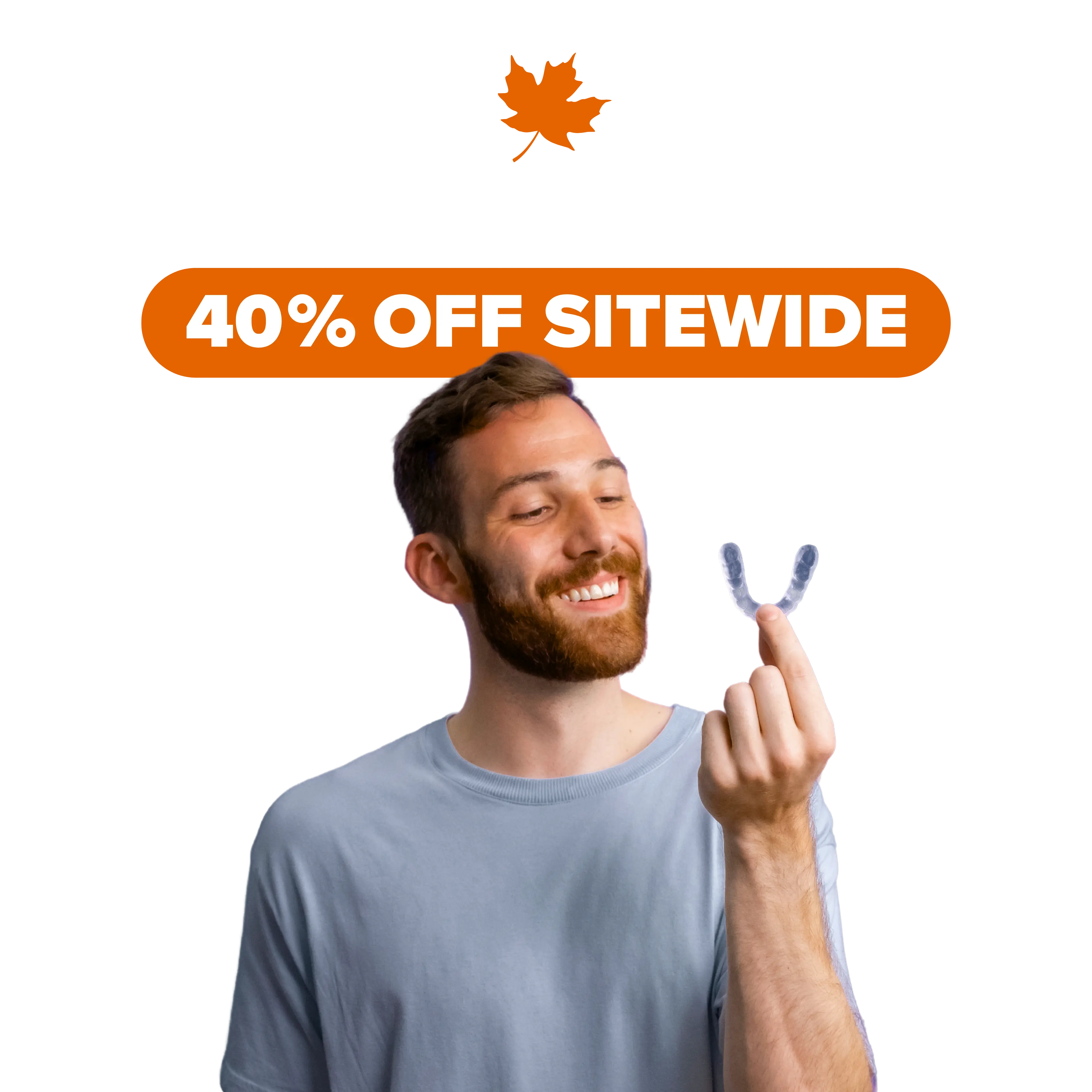Man holding a clear aligner with 'Fall sale' text above on a white background