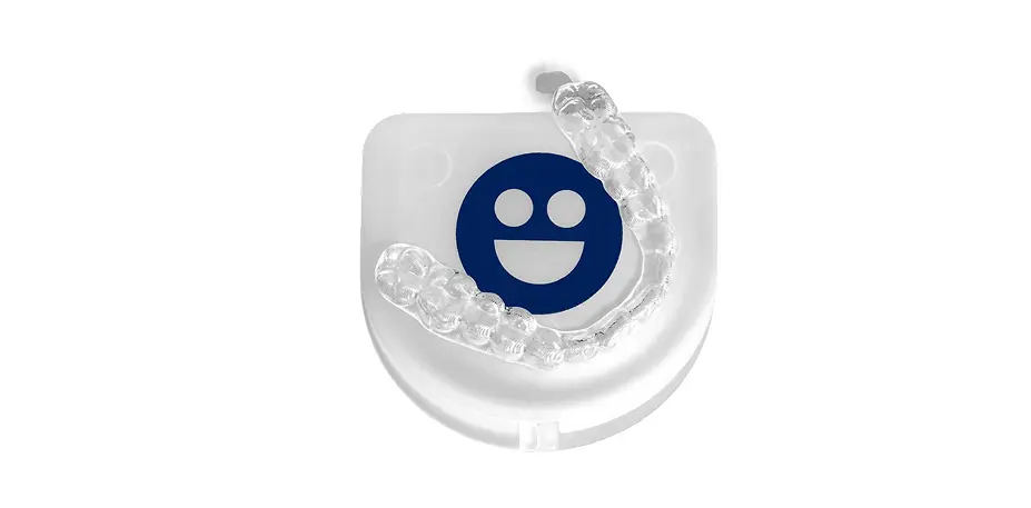Clear dental retainer with a smiley face design on a white background