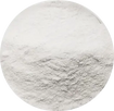 A close-up circular view of a light gray to off-white powder or fine granular material filling the frame.